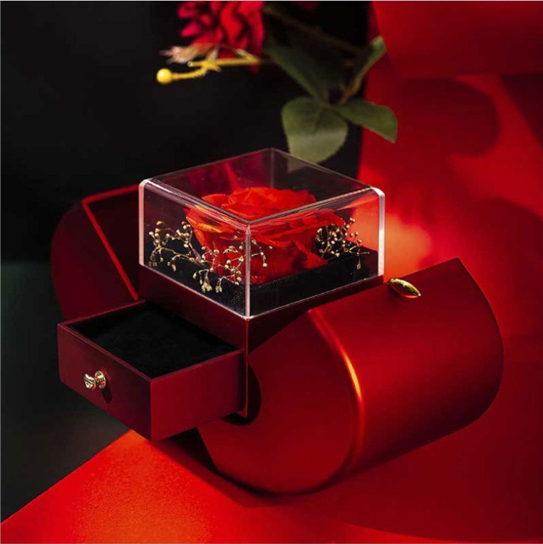 Apple rose box open, rose under a clear cover and the drawer pulled out