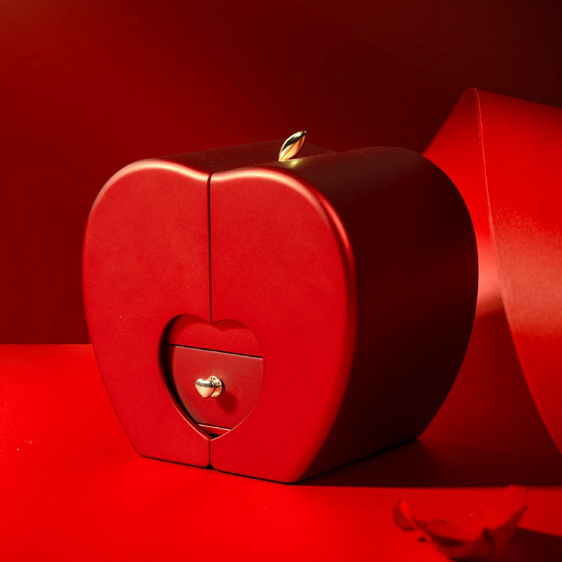 Closed red apple-shaped gift box