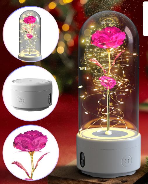 Pink color rose lamp on a white base, lit up