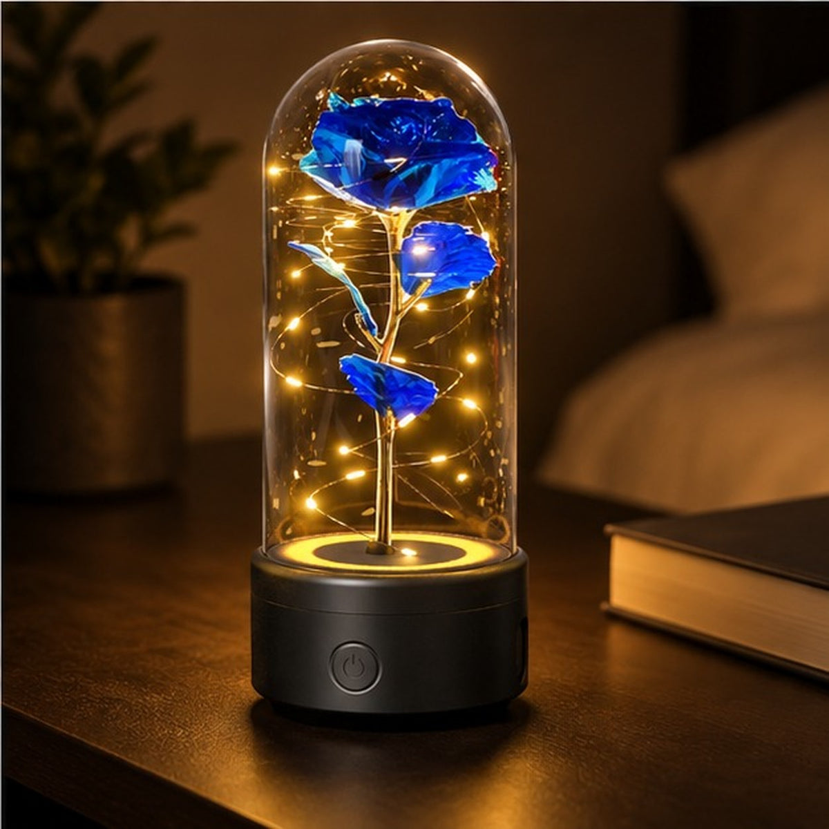 Blue rose lamp glowing on a bedside table