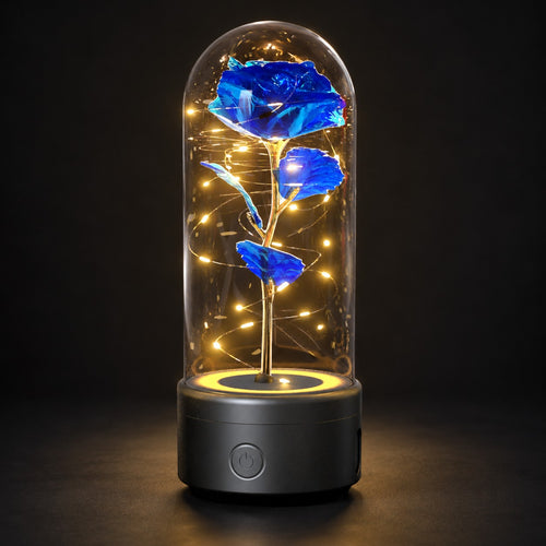 Blue rose lamp on a black base, glowing