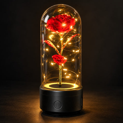 Red rose lamp on a black base, glowing